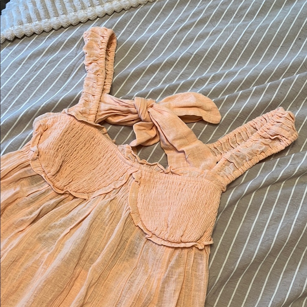 Women’s peach dress with tie back